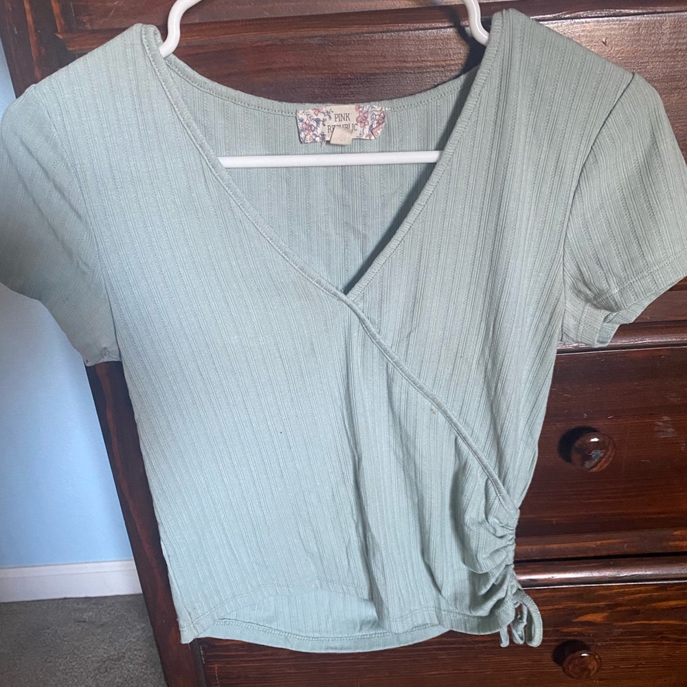 Teal cropped top.